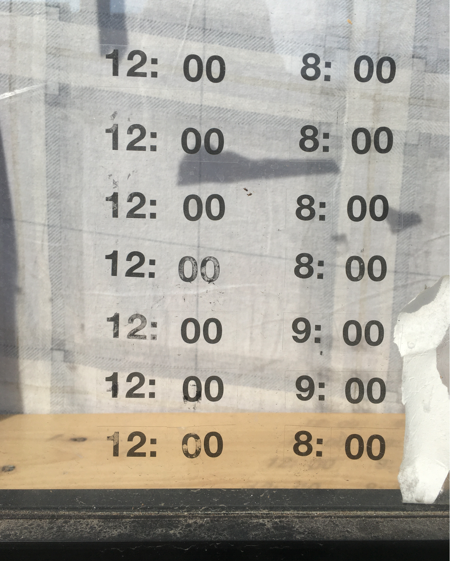 Photo of poster with times in two columns and seven rows